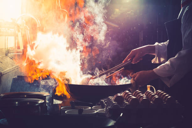 istock Chef  stir fry cooking 1271180939