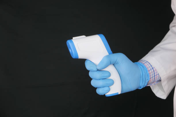 istock Hand holding infrared thermometer to measuring temperature. 1271181331