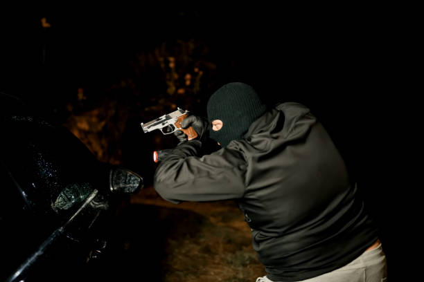 istock Violence and theft in the Coronavirus era. Man stealing a car 1271183318