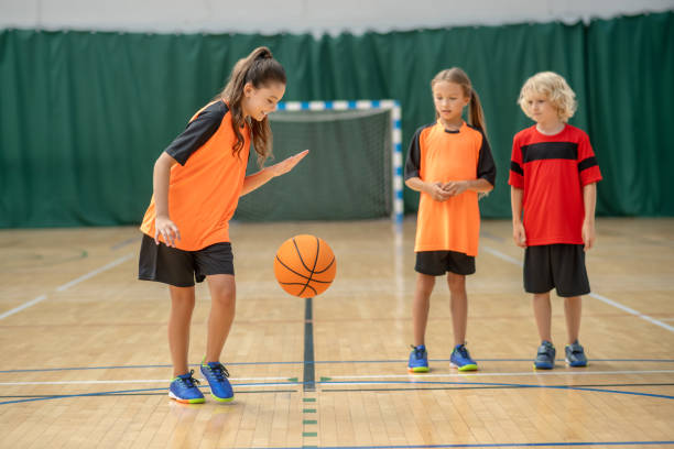 istock A girl playing with a ball and looking enjoyed 1271183648