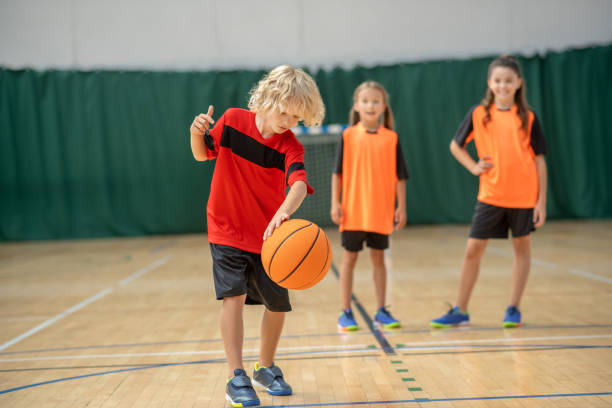 istock A boy playing with a ball and looking involved 1271183651