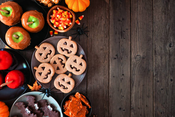istock Rustic Halloween treat side border over a dark wood background 1271183758
