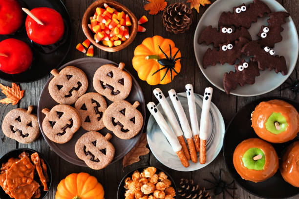 istock Halloween treat table scene, above view over a rustic dark wood background 1271183769