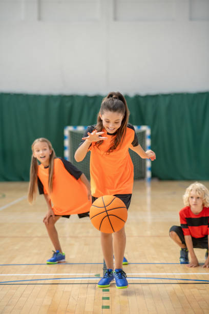 istock A girl playing with a ball and looking involved 1271183792