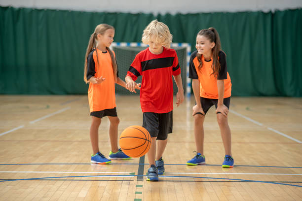 istock Children playing with a ball and looking involved 1271183798