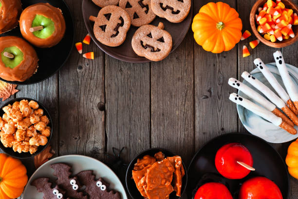 istock Rustic Halloween treat frame overhead on a dark wood background 1271184443