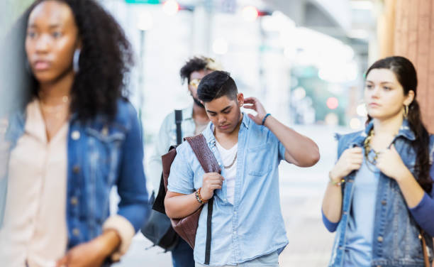 istock Multi-ethnic young adults walking in the city, strangers 1271185139