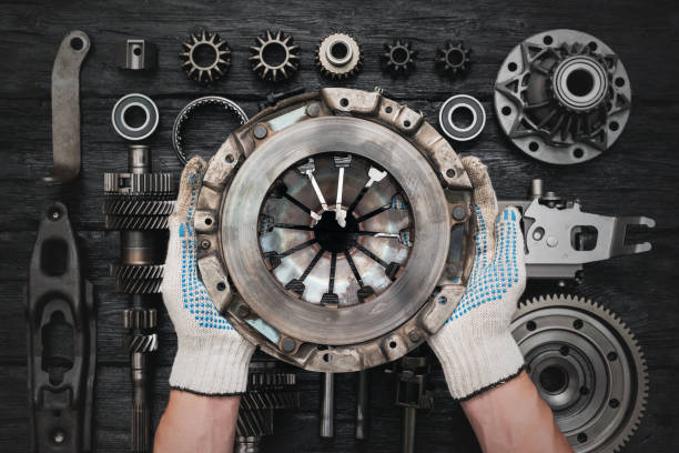 Car clutch basket. Old car clutch basket in auto service worker hands close up. spare part stock pictures, royalty-free photos & images