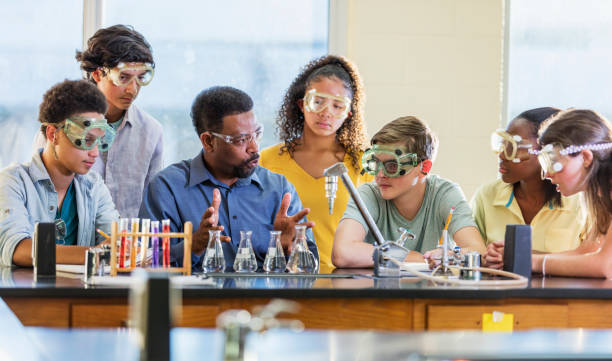 istock African-American man teaching high school chemistry lab 1271187098