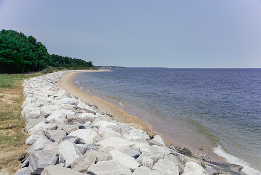 Rip rap rock wall protecting the shoreline on a river