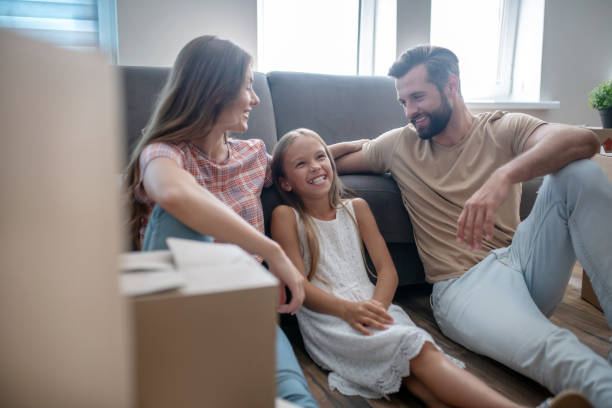 istock Family resting on the sofa and smiling 1271188353