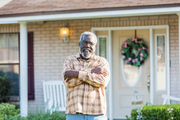 istock Senior man standing in front of home 1271188893