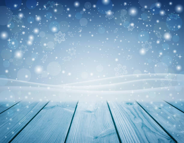 istock Christmas background. Snowflakes swirl in the rays of light. Blizzard. Snowfall. Empty table and place for text. 1271190133