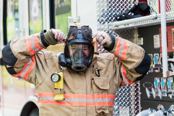istock Firefighter in fire protection suit and respirator mask 1271192567