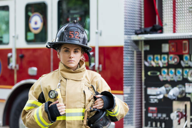 istock Female firefighter in fire protection suit 1271192766