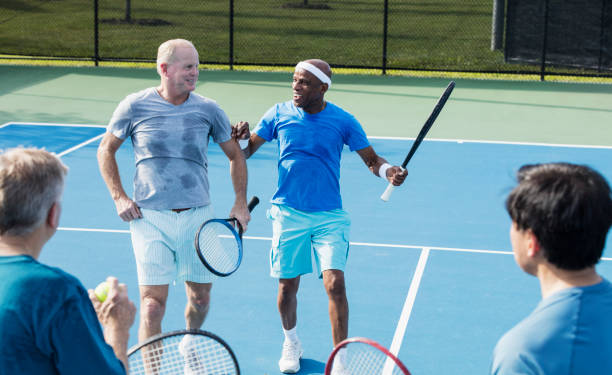 istock Men playing tennis, meeting at the net 1271195197