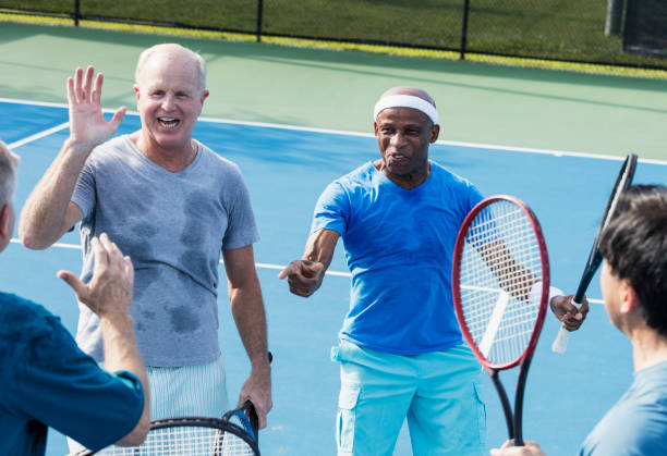 istock Men playing tennis, meeting at the net 1271195209