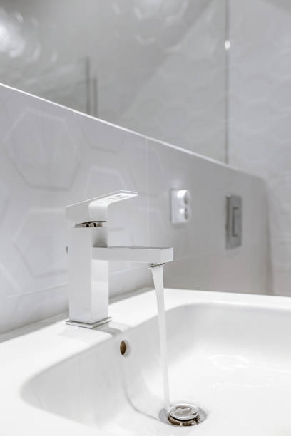 istock Modern white bathroom faucet 1271195231