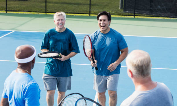istock Men playing tennis, meeting at the net 1271195283