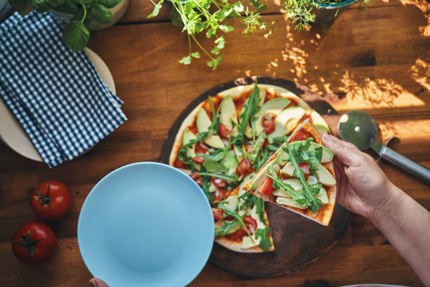 istock Vegan Avocado Pizza with Tomato and Arugula 1271196373