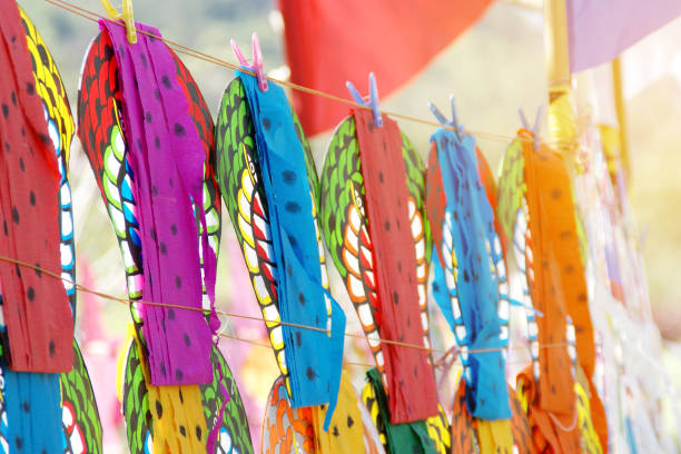 istock Colorful Snake Kites Hanging for Sell 1271199000