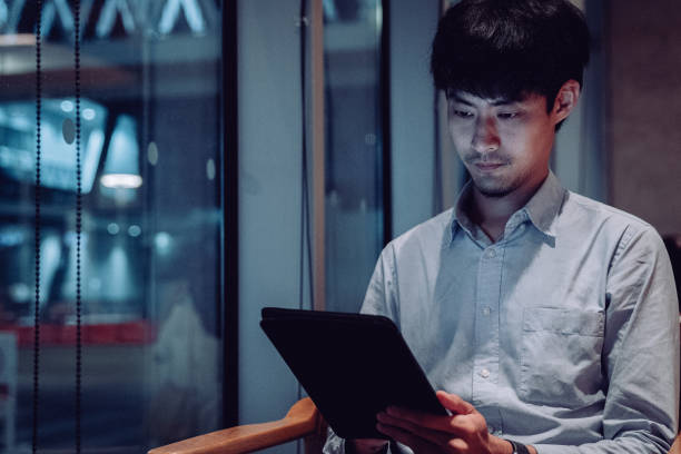 istock Man browsing internet, chatting, blogging. Male holding phone and looking on his screen. 1271199570
