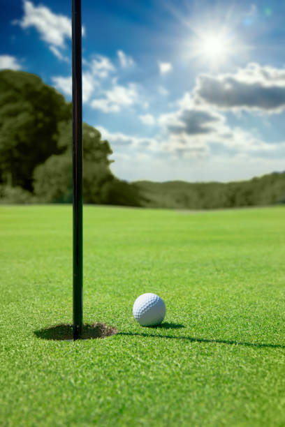 istock Golf Ball By Edge of Hole 1271199583