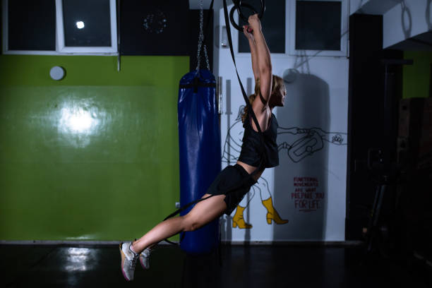 istock A fit woman swinging on rings 1271204622