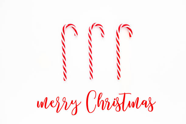 istock Merry Christmas card with Candy cane. Candies on white background. Flat lay, top view 1271205401