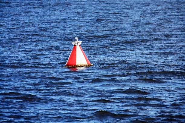istock red and white buoy in the water 1271206091