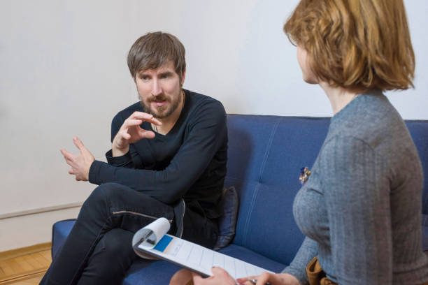 istock A man talks about his problems to a psychologist. Psychological treatment. 1271206873