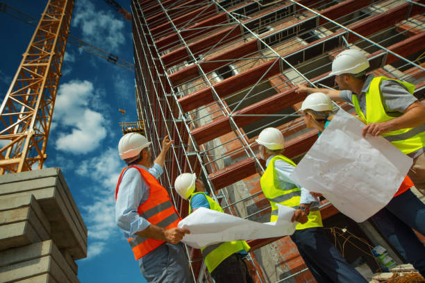 istock Group of contractors supervising building process 1271207259