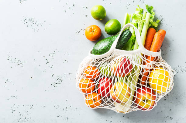 istock Fruits and vegetables in eco friendly (zero waste) shopping bag 1271207659