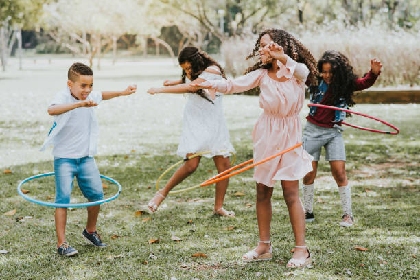istock group of children playing with hula hoop 1271208263