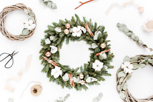 istock Wreath frame and wreath from vine and eucalyptus branch on white background. Flat lay, top view holiday decoration concept. Christmas composition 1271209757