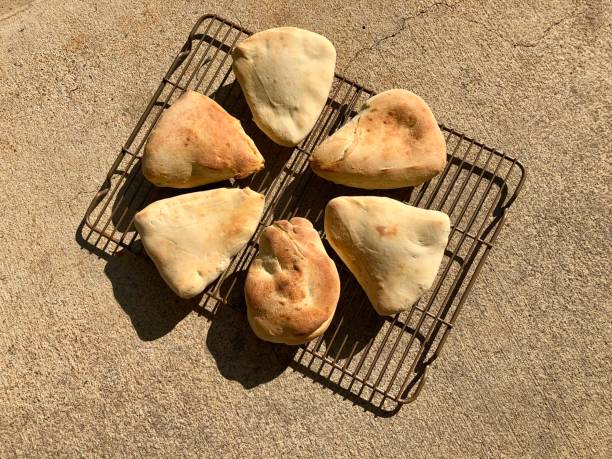istock Homemade naan bread on a cooling rack 1271211900