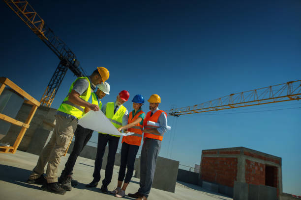 istock Group of contractors supervising building process 1271214160