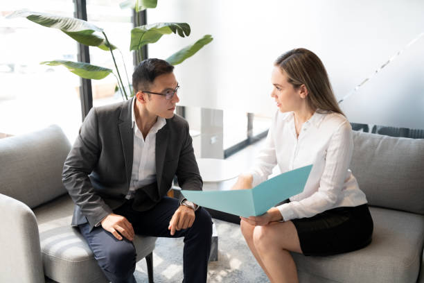 istock Business partners discussing over a file 1271215783