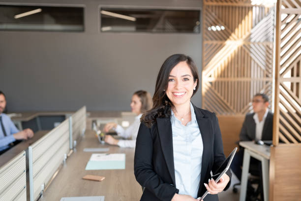 portrait of successful female lawyer - lawyer young adult suit expressing positivity imagens e fotografias de stock