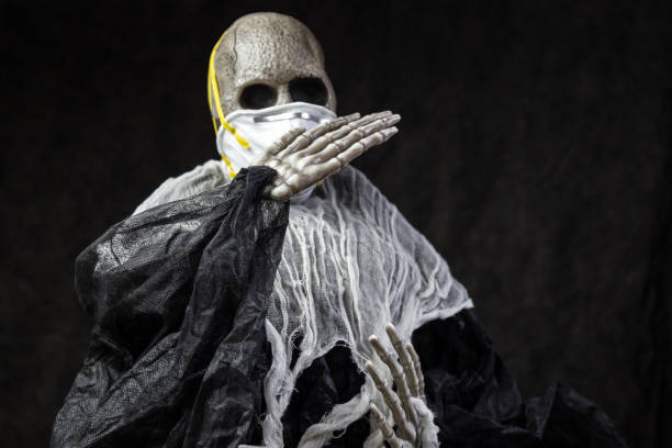 istock Skeleton Wearing a N95 Protective Face Mask 1271215836