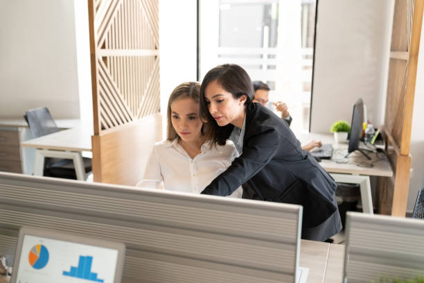 istock Two female colleagues in office working together 1271215910