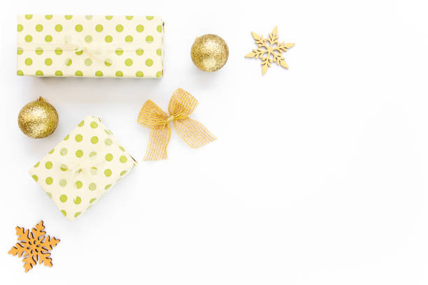 istock Christmas Texture made of gold decorations on white background with empty copy space for text. Holiday and celebration concept. Top view. Flat lay 1271216139