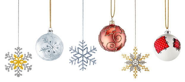 Hanging Christmas Ornaments. Snowflakes and Balls over White Background.