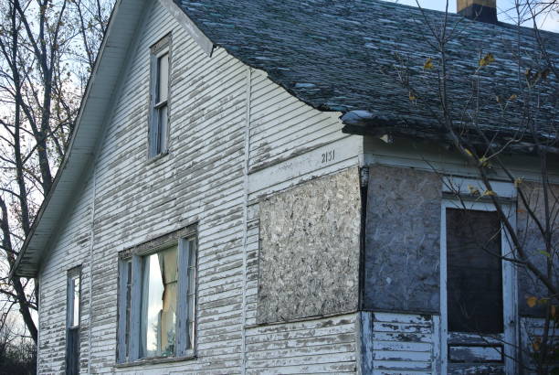 Broken but not destroyed house.