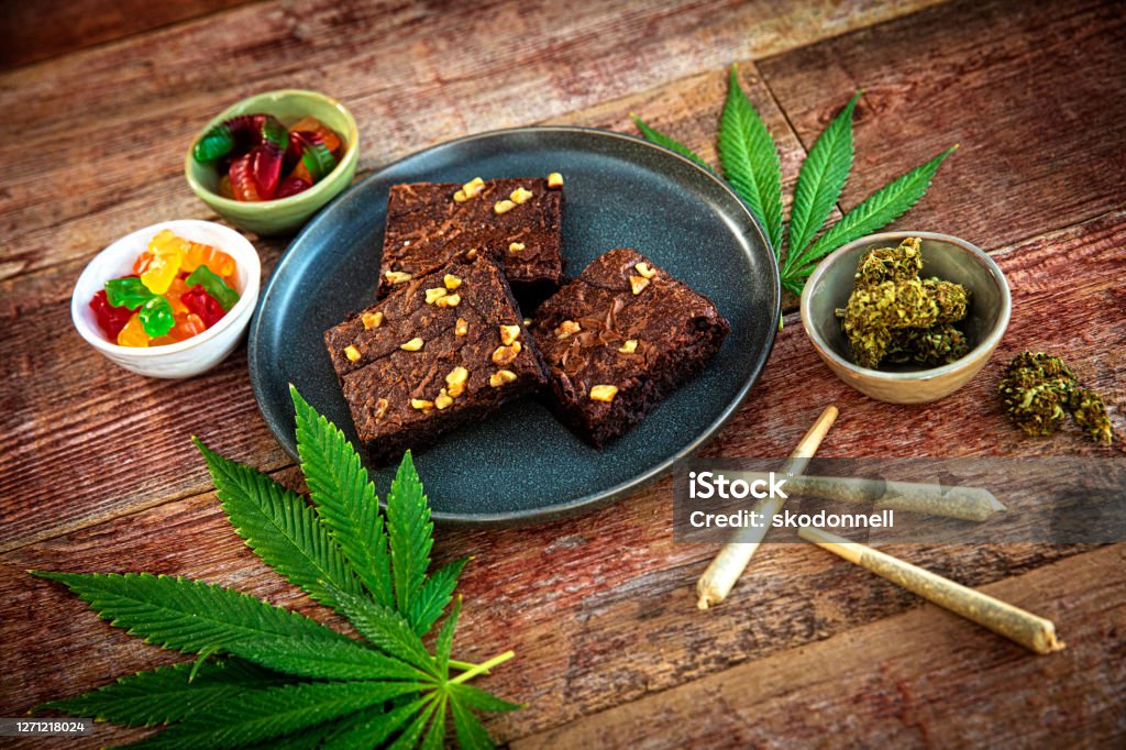 Cannabis joints and brownies for Medicinal Use This is a stock photograph involving cannabis in brownies, marijuana and its implications in America has just slowly been legalized and used for medicinal and medical purposes and what that means to our economy and culture. Cannabis Plant Stock Photo