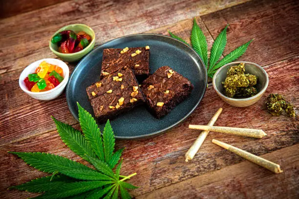 This is a stock photograph involving cannabis in brownies, marijuana and its implications in America has just slowly been legalized and used for medicinal and medical purposes and what that means to our economy and culture.