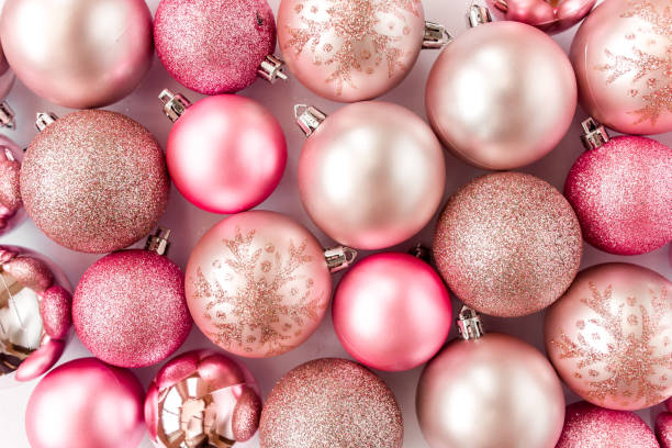istock Christmas texture: pink glass christmas balls on white background. flat lay, top view 1271219443