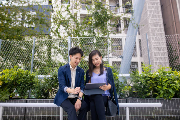 istock Young business people working in public park 1271222081