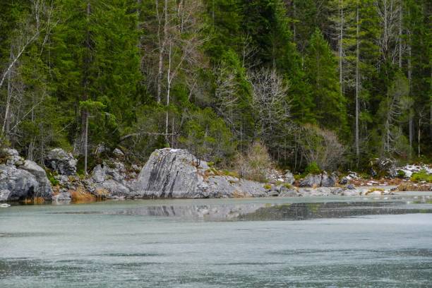 istock Ice on Mountain Lake in the Alps 1271226320