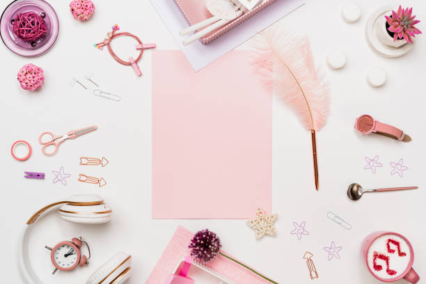 istock Creative woman desk top view with pink blank paper 1271227720
